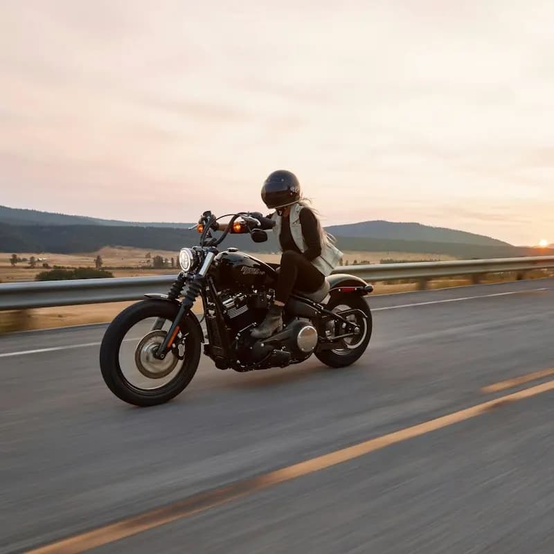 A rider on a motorcycle on an open road