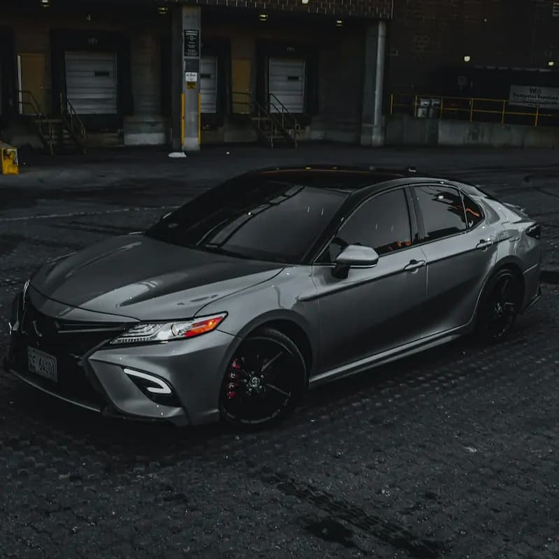 A gray sedan in a garage