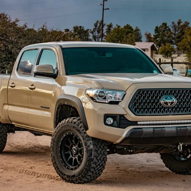 A tan pickup truck off-road